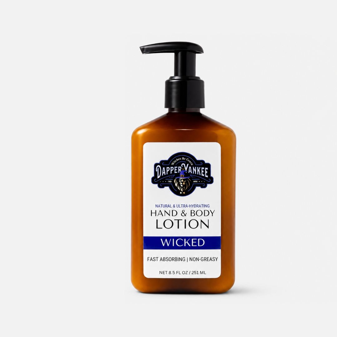 A bottle of Dapper Yankee Wicked Hand & Body Lotion in an amber-colored plastic bottle with a black pump dispenser and a white label featuring navy blue text and logo.