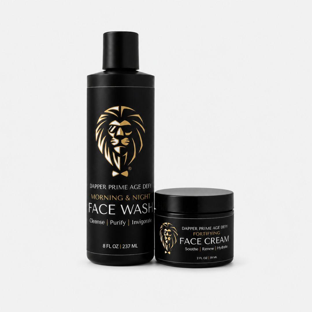 A black bottle of Dapper Prime Age Defying Morning & Night Face Wash and a matching black jar of Face Cream, both featuring a gold lion logo and text, set against a light gray background.