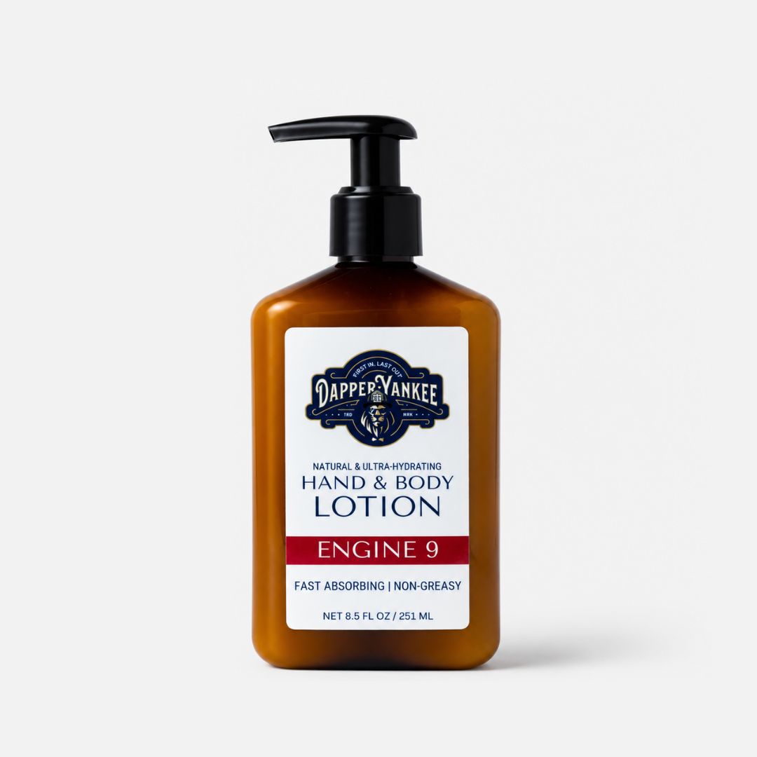 Dapper Yankee Engine 9 Hand & Body Lotion in an amber brown pump bottle with a white and navy label, set against a light gray background.
