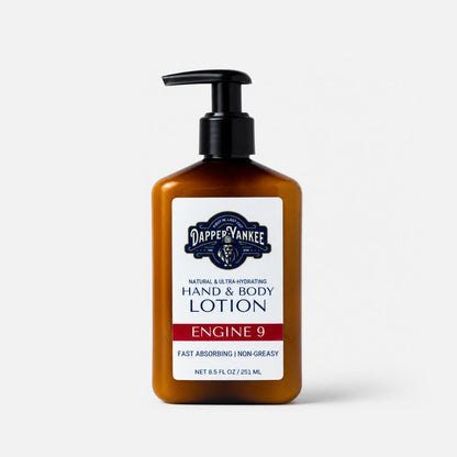 Dapper Yankee Engine 9 Hand & Body Lotion in an amber brown pump bottle with a white and navy label, set against a light gray background.