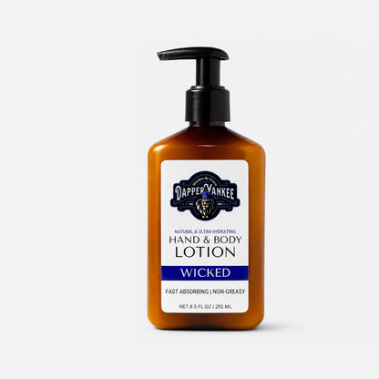 A bottle of Dapper Yankee Wicked Hand & Body Lotion in an amber-colored plastic bottle with a black pump dispenser and a white label featuring navy blue text and logo.