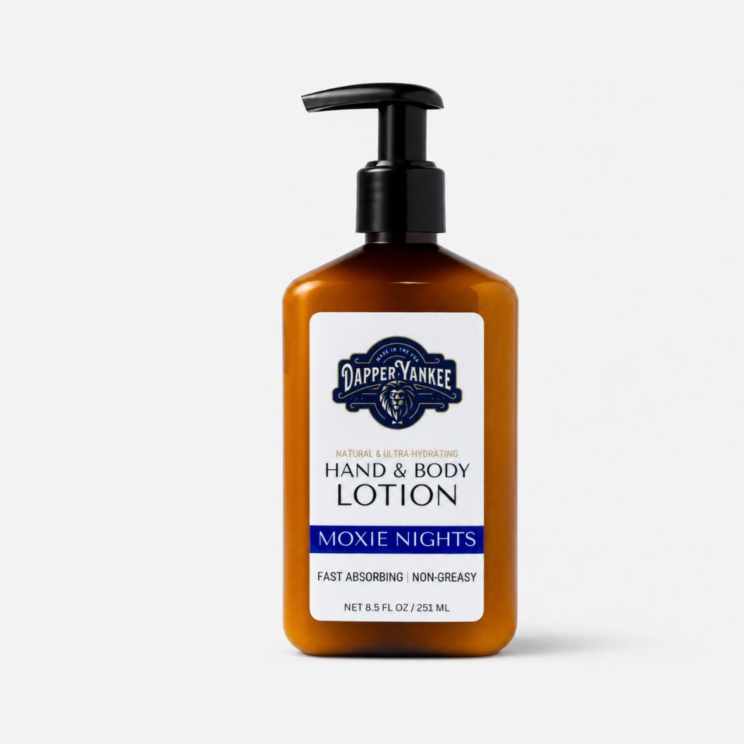 Dapper Yankee Moxie Nights Hand & Body Lotion in an amber bottle with a black pump dispenser and a white label, set against a light gray background.