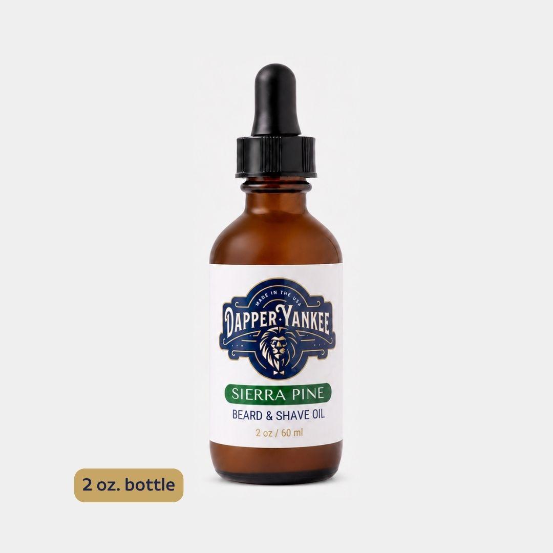 A 2 oz amber glass dropper bottle of Dapper Yankee Beard & Shave Oil in the Sierra Pine scent, shown on a light gray background with a small '2 oz. bottle' label overlay in the bottom left.