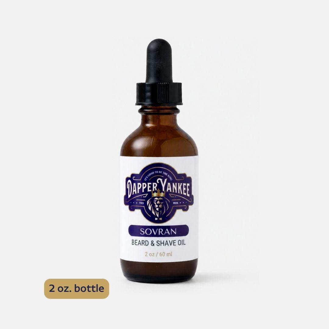 A 2 oz amber glass dropper bottle of Dapper Yankee Sovran Beard & Shave Oil, shown on a light gray background with a small gold label indicating '2 oz. bottle'.